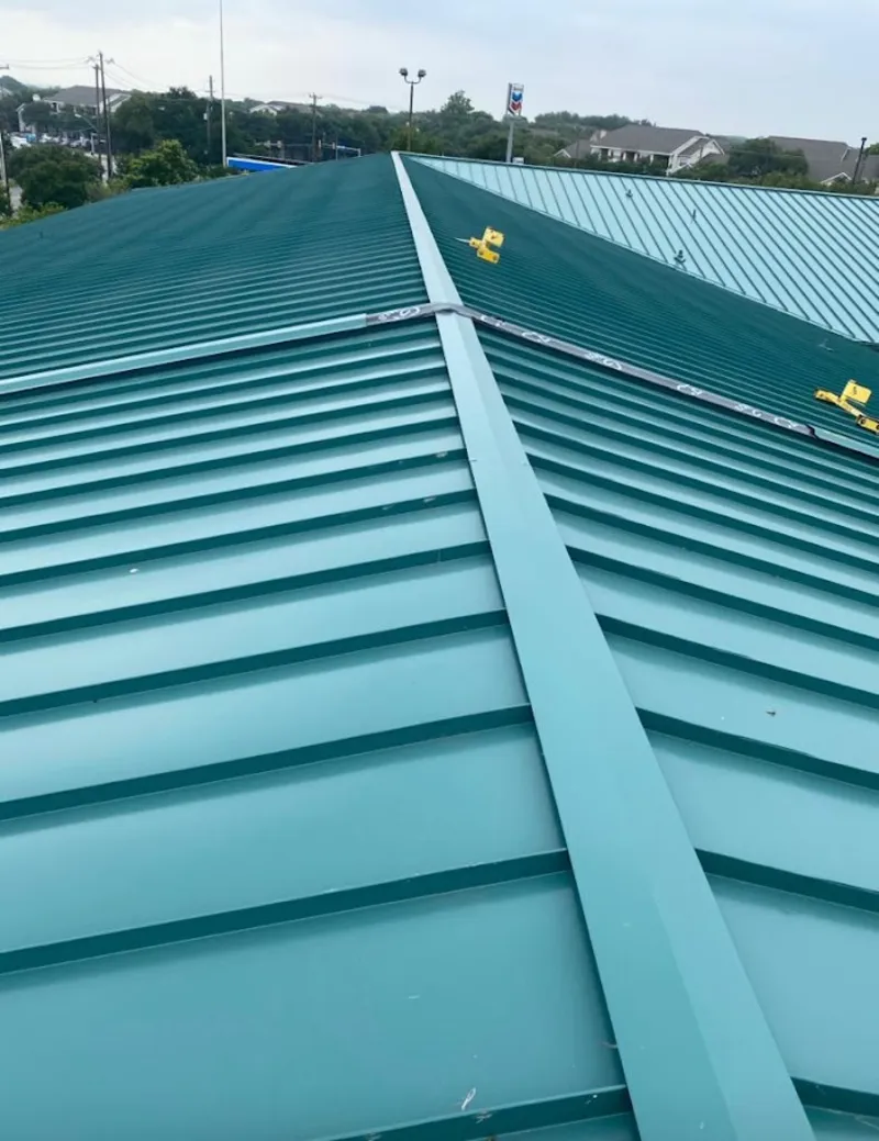 Green commercial metal roof ridge and valley for Metal Roof Repair in Colonie